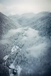 Plane Is Flying Over A Snowy Mountain