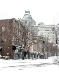 Street Scene With A Building And A Snow Covered Street