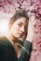 Woman Is Holding A Flower In Her Hand