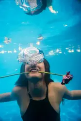 Woman Is Holding A Piece Of Glass In Her Hand