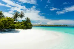 Beach With A Blue Sky And A Blue Ocean