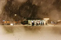 People Standing On A Snowy Street