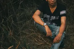 Man Sitting On A Pile Of Hay
