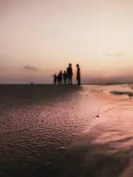 People Are Walking On A Beach