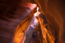 Blurry Photo Of A Rocky Area With A View Of A Train