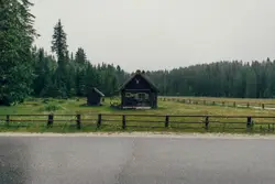 Large Wooden Fence With A Horse Standing On It
