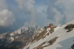 Person On A Snow Board Going Down A Mountain