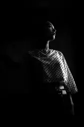 Man Is Standing In A Dark Room