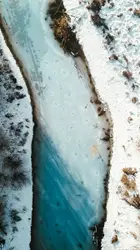 River With A Pile Of Snow On Top Of It