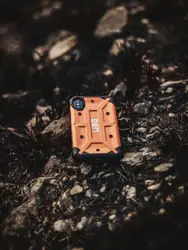 Small Blue Suitcase On A Rock