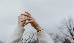 Person Holding A White And Black Object