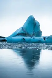 Large White Sheet Of Snow On Top Of A Blue Ocean