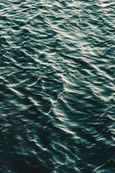 Large Body Of Water With A Blue Sky
