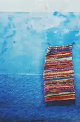 Red And White Striped Tie Hanging On A Wall