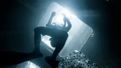 Person Standing In The Dark With A Flashlight