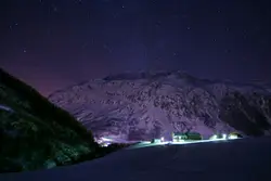 Houses near snowcapped mountains