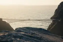 White bridge on body of water during daytime