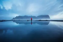 Joshua Earle standing in still waters before the Vestra
