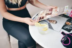 Woman sitting and holding paper