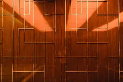 A room with a wooden wall and a clock on the wall