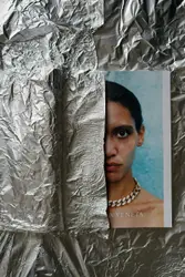 Woman wearing silver colored necklace Veneta poster