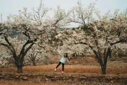 Woman in white long sleeve shirt and blue denim jeans s