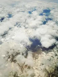 Snow covered mountains in clouds