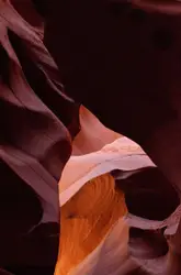A narrow slot in the side of a canyon