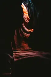 The light is shining on the rock formations