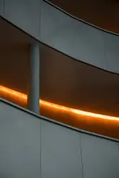 White concrete staircase with gray metal railings