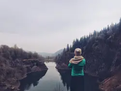 Woman looking off into a rocky basin