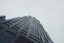 Worm's eye view photography of black building