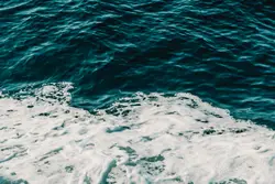 Ocean waves crashing on shore during daytime