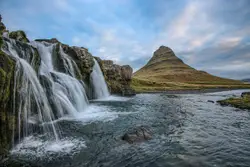 Body of water behind mountain landscape photgraphy