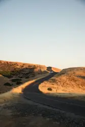 Lone Person On A Dirt Road On A Sunny Day