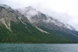 Misty mountains along the lake