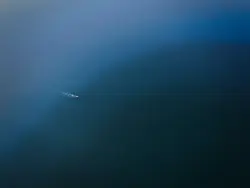 Boat sailing in blue sea