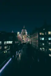 Group of person walking on gray bridge