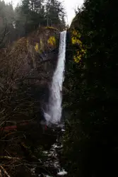 River With A Waterfall And A Person On A Skateboard