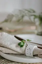 Selective focus photo of white table napkin cloth on wh