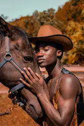 Man wearing brown cowboy hat