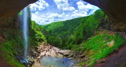 Rock arch over a pond