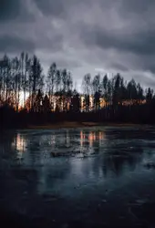 Body of water under gray sky