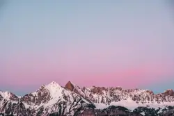 Lovely sunset behind a snowy mountain in Flums Switzerl