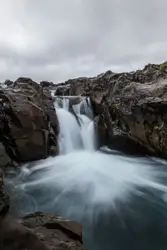 Time lapse photography of flowing multi tier waterfall