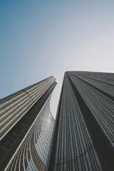 Low angle photo of gray concrete high rise building