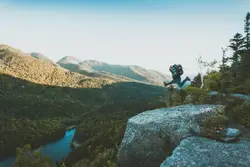Time lapse photo of person jumping from cliff within mo