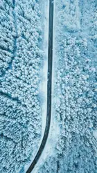 Snowy Welsh road from drone, Audi SQ5 down below.