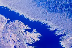 Aerial photo of body of water in between mountains