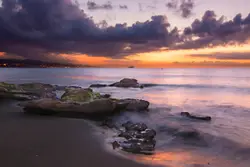 Seashore under cloudy sky